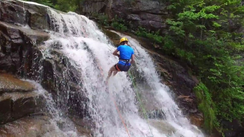 Go waterfall rappelling through New Hampshire’s White Mountains